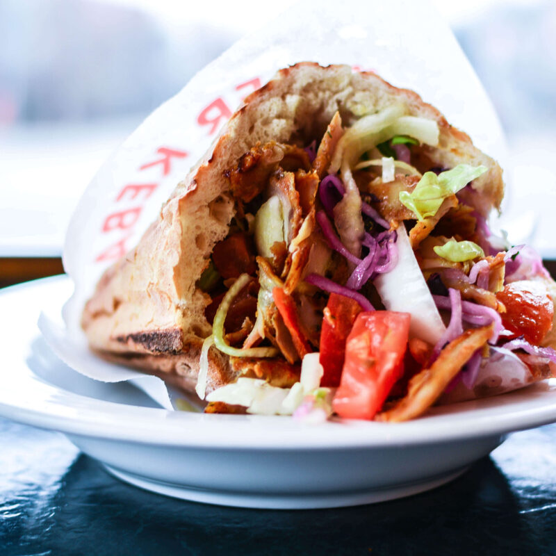 close-up-doner-kebab-served-plate-table
